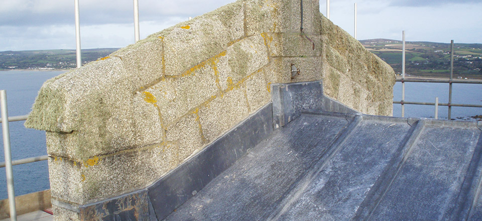 Detail of front apron and cover flashing to granite chimney on West elevation of castle on St Michael's Mount
